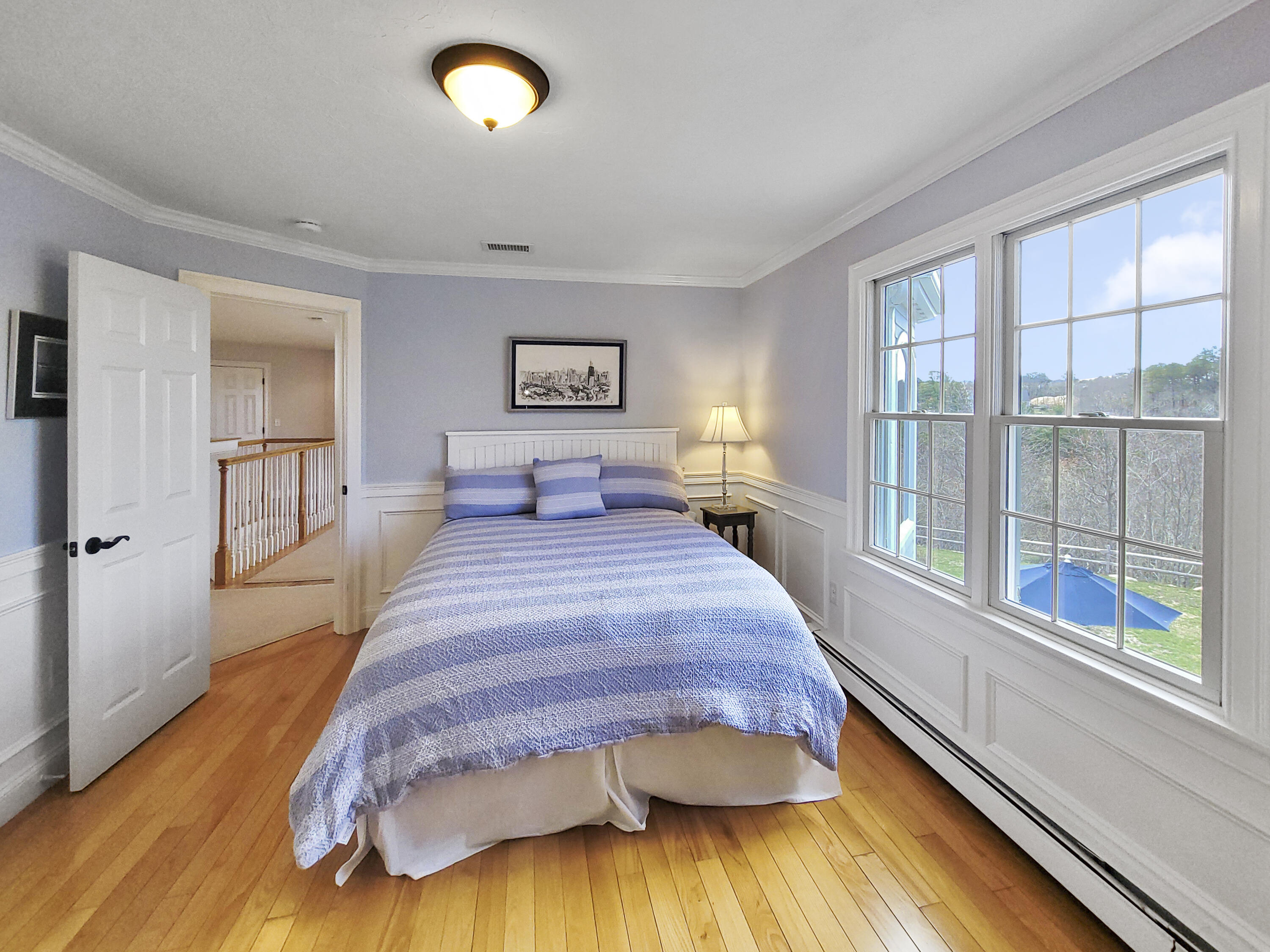 215 Cairn Ridge Road East Falmouth, MA 02536 - Photo 30 of 60 a spacious bedroom with a bed and a large window