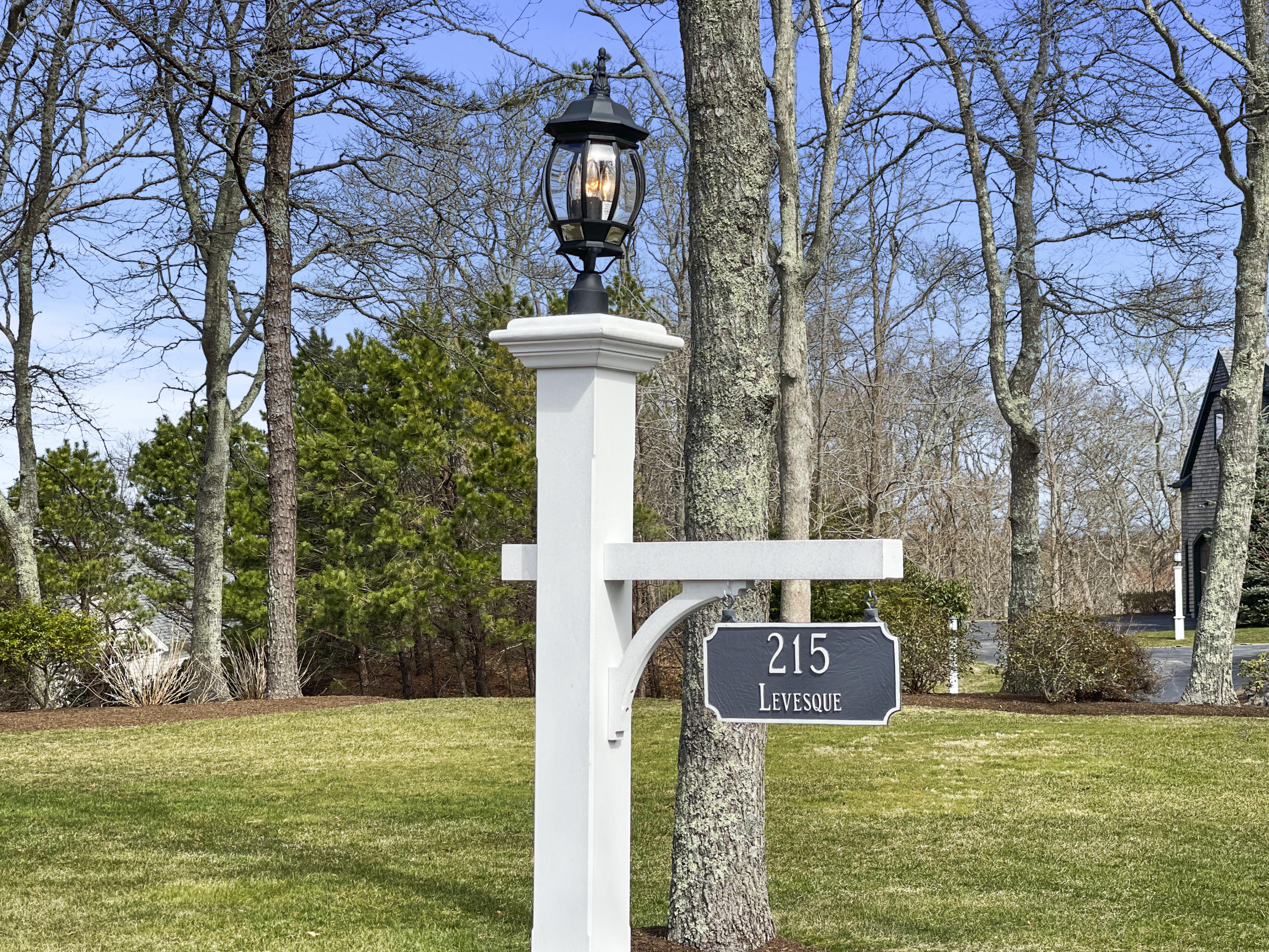 215 Cairn Ridge Road East Falmouth, MA 02536 - Photo 3 of 60 a front view of a house with a yard