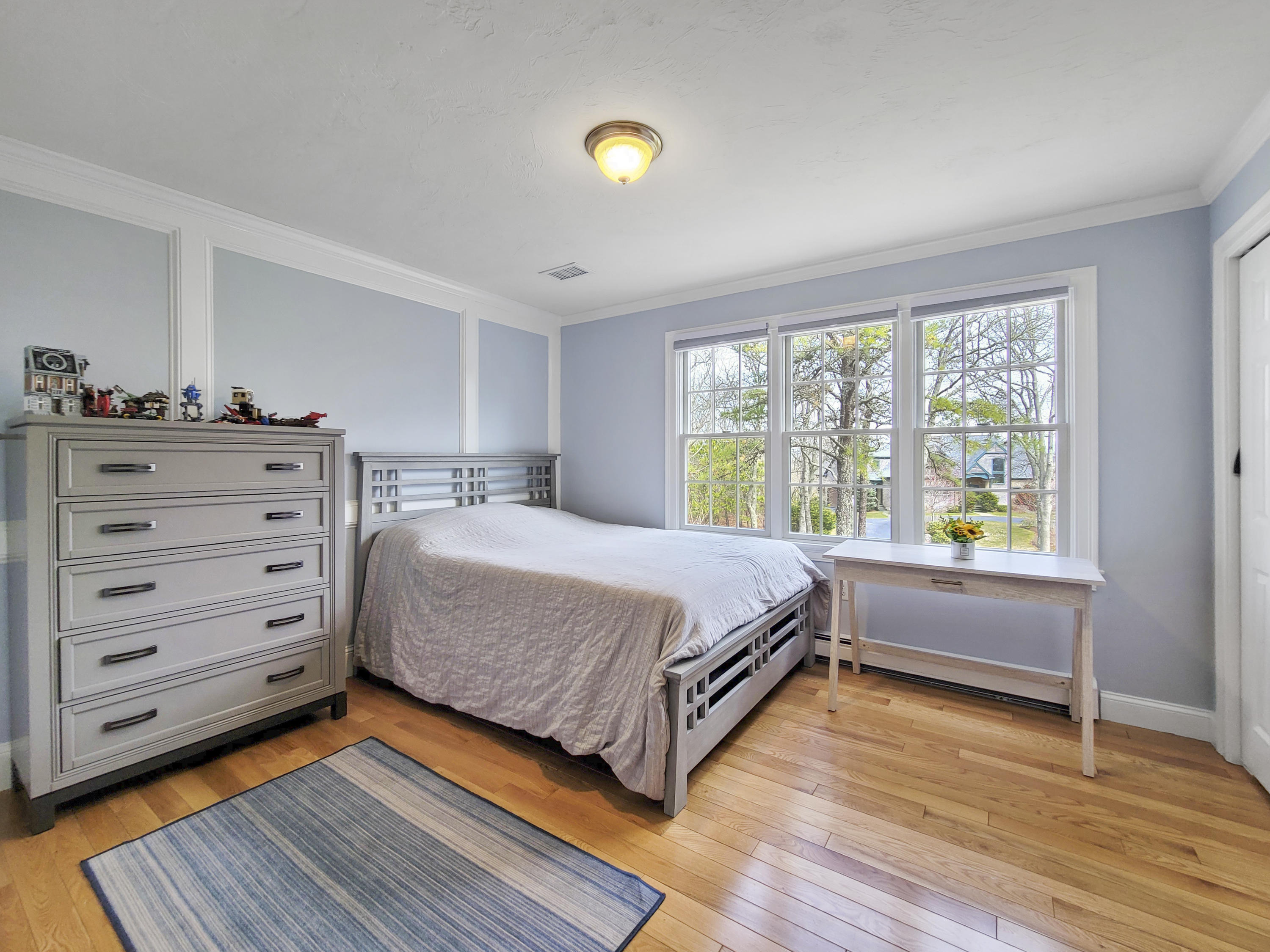 215 Cairn Ridge Road East Falmouth, MA 02536 - Photo 34 of 60 a spacious bedroom with a bed and a window