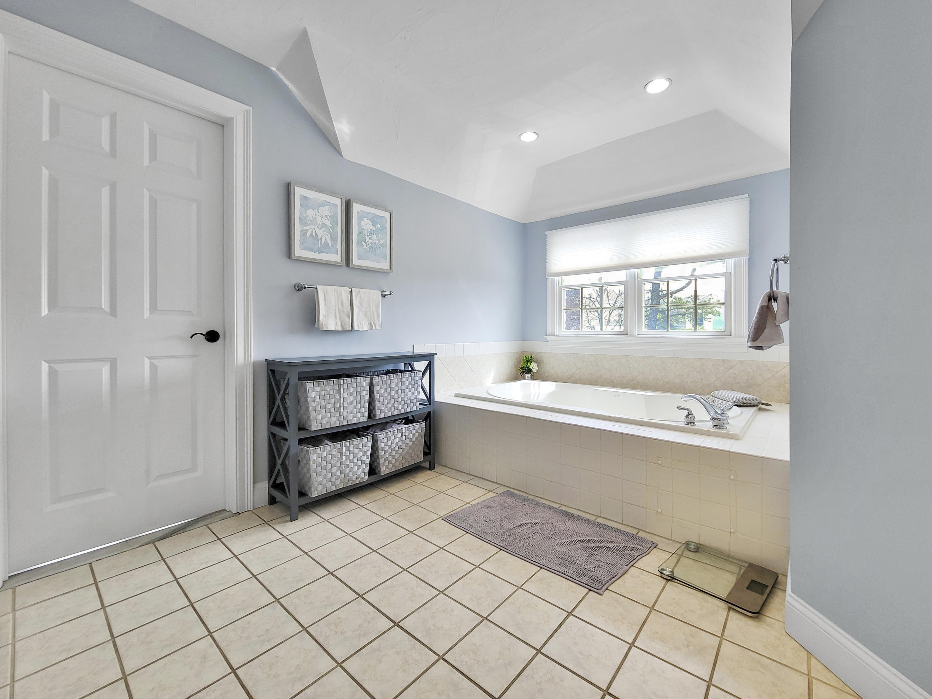 215 Cairn Ridge Road East Falmouth, MA 02536 - Photo 40 of 60 a spacious bathroom with a bathtub and window