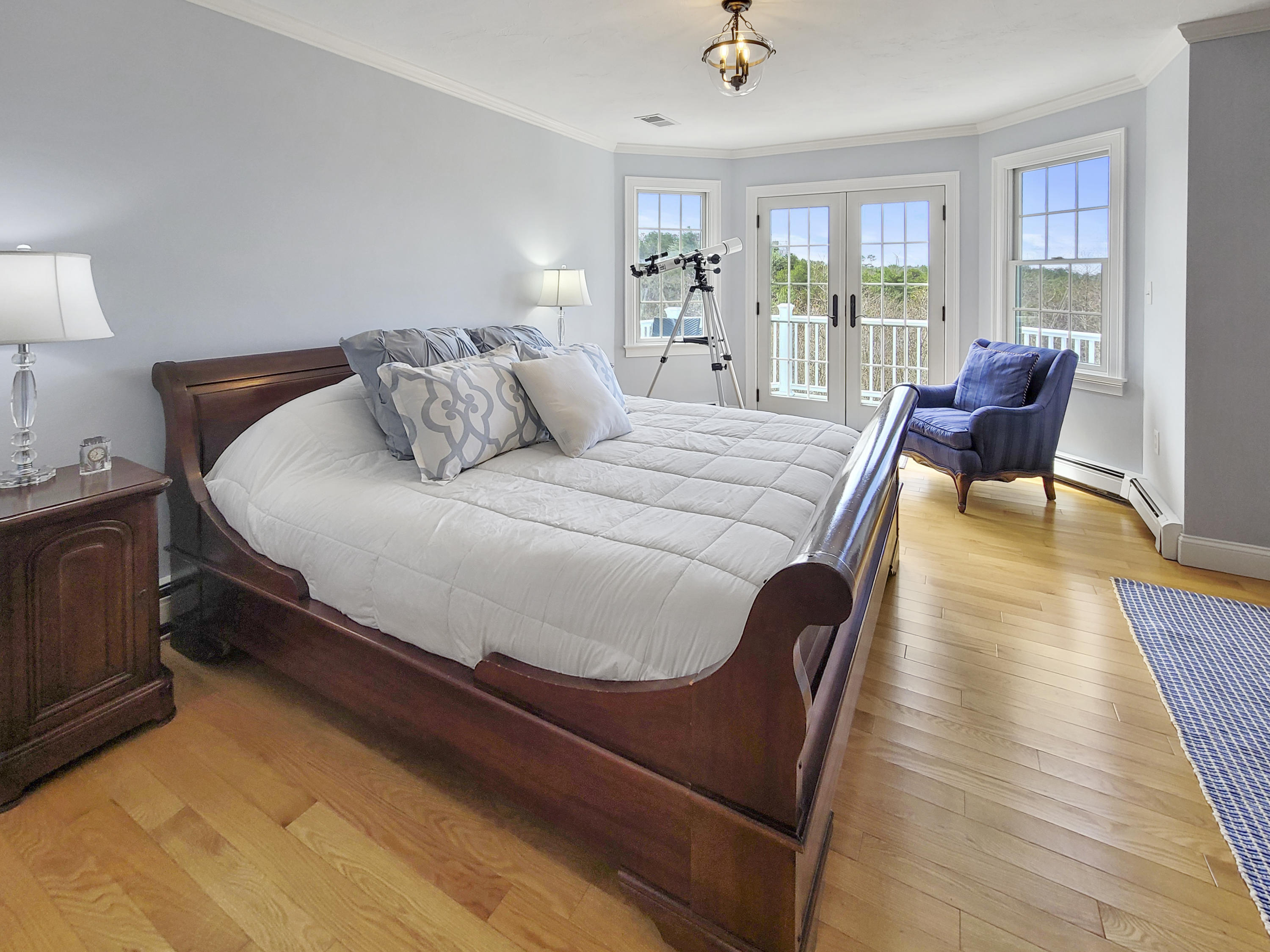 215 Cairn Ridge Road East Falmouth, MA 02536 - Photo 42 of 60 a bed sitting in a bedroom next to a window