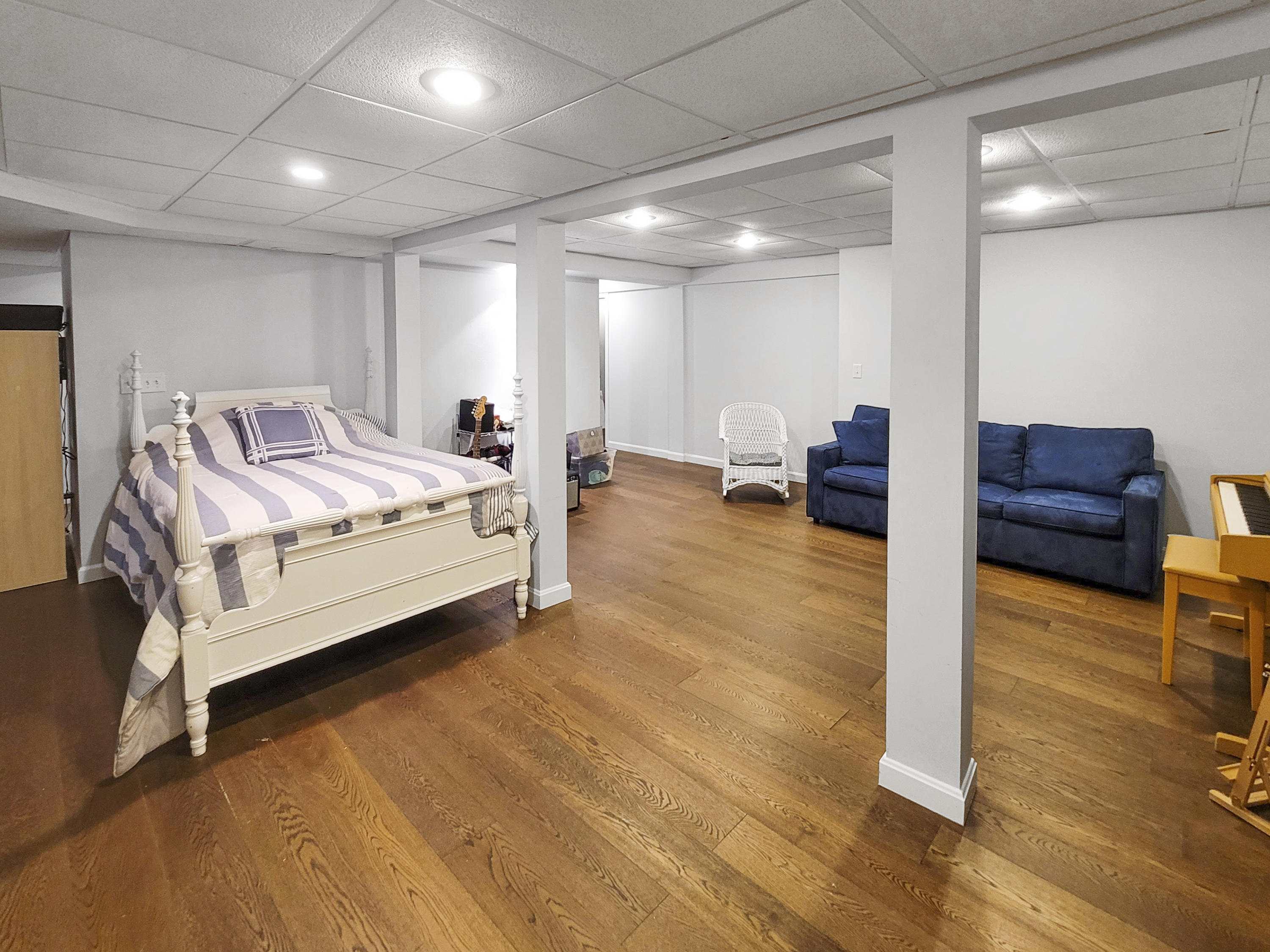 215 Cairn Ridge Road East Falmouth, MA 02536 - Photo 46 of 60 a spacious bedroom with a bed and a table in it