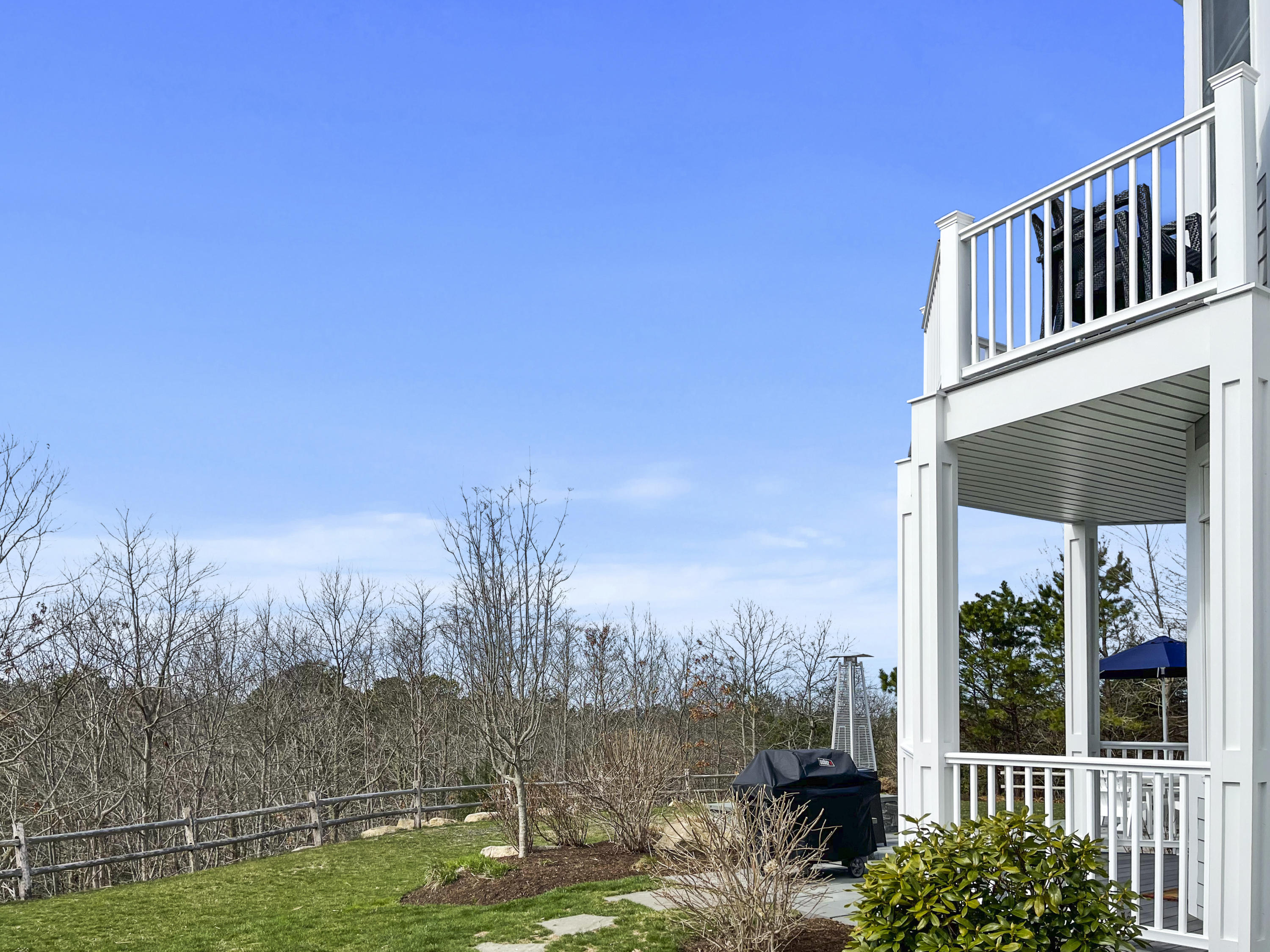 215 Cairn Ridge Road East Falmouth, MA 02536 - Photo 47 of 60 a view of a yard with wooden fence