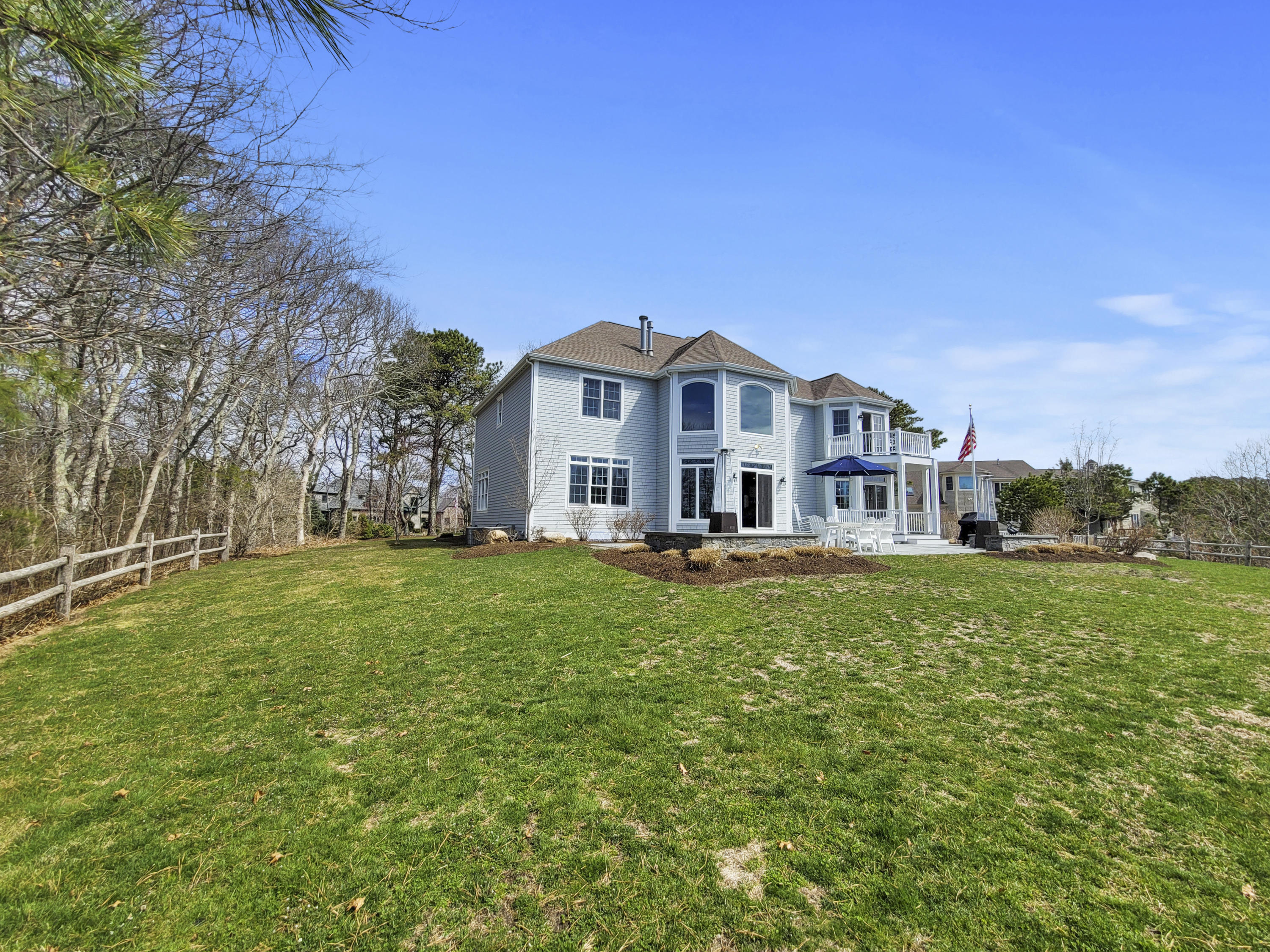 215 Cairn Ridge Road East Falmouth, MA 02536 - Photo 51 of 60 a view of a house with a big yard