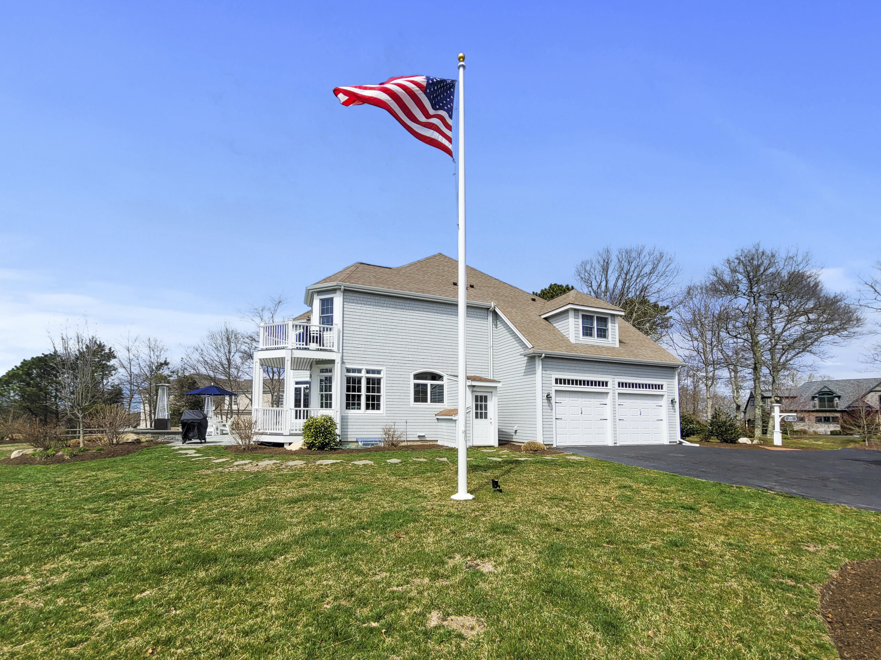 215 Cairn Ridge Road East Falmouth, MA 02536 - Photo 52 of 60 a front view of a house with a yard