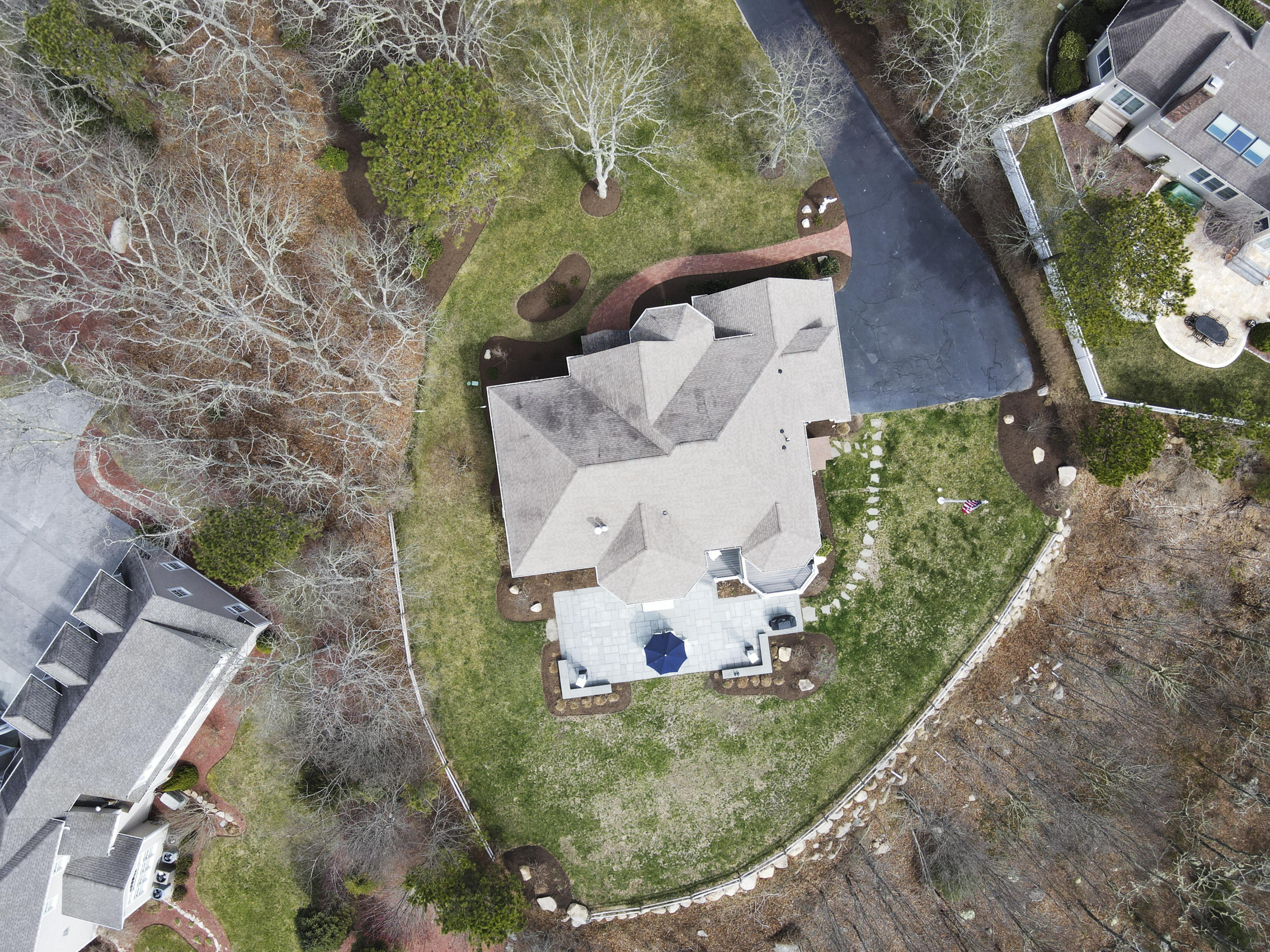 215 Cairn Ridge Road East Falmouth, MA 02536 - Photo 57 of 60 an aerial view of a house with a yard and trees