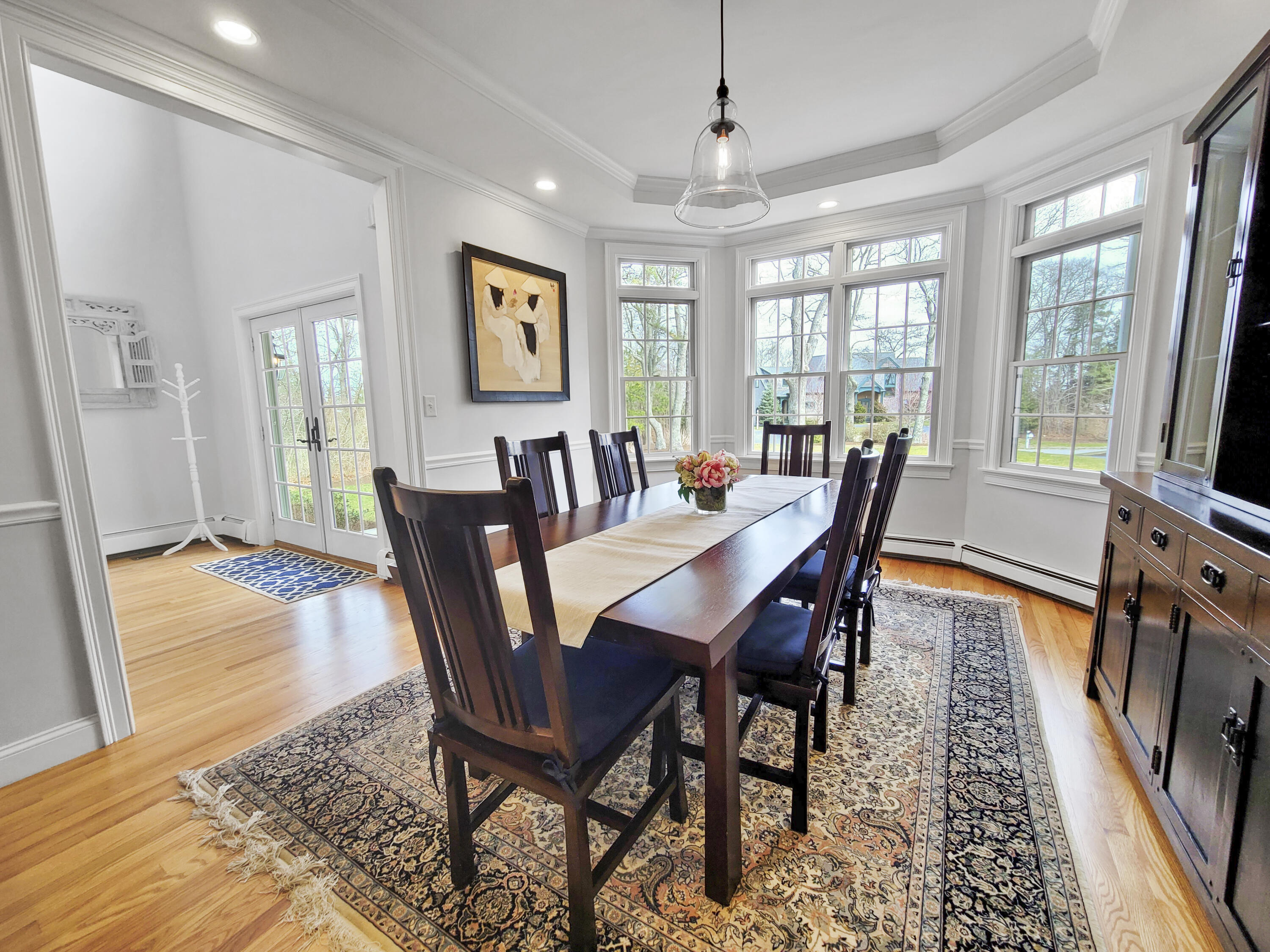 215 Cairn Ridge Road East Falmouth, MA 02536 - Photo 6 of 60 a view of a dining room with furniture window and wooden floor