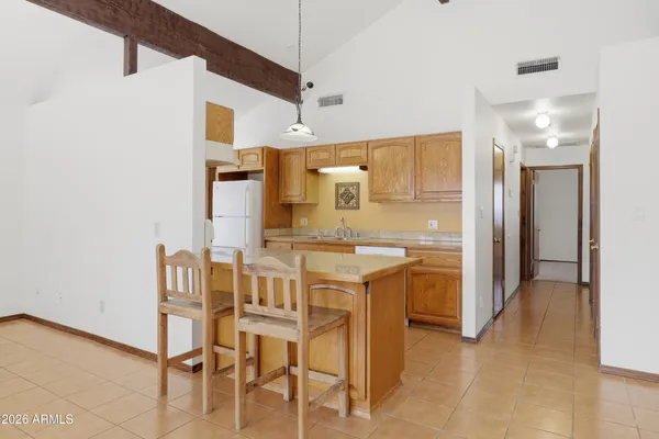 a kitchen with stainless steel appliances granite countertop a sink and a stove