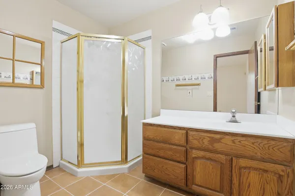 a living room with a couch and a lamp on table