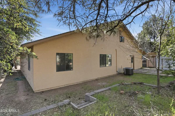 a view of backyard with green space