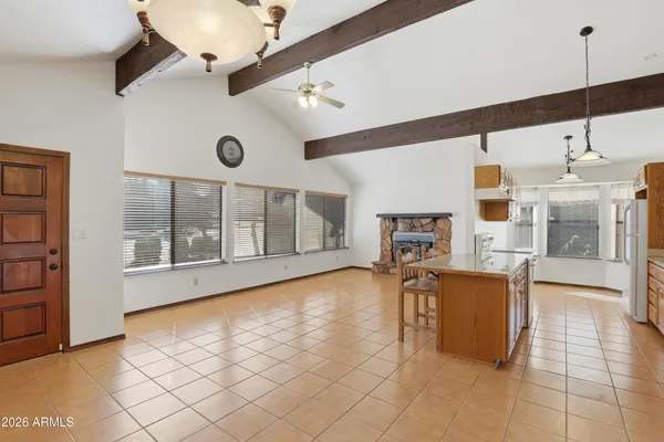 a view of a livingroom with furniture and a ceiling fan