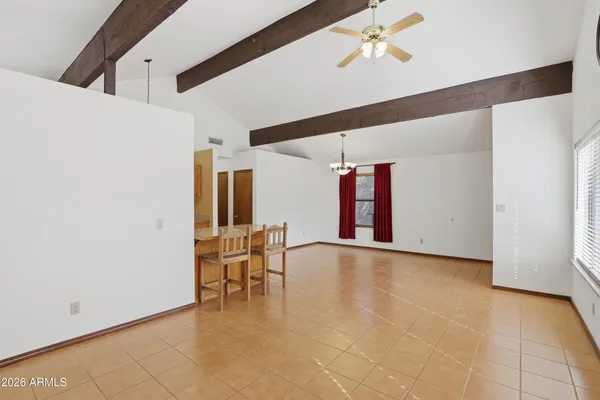 a kitchen with stainless steel appliances kitchen island granite countertop a refrigerator and cabinets