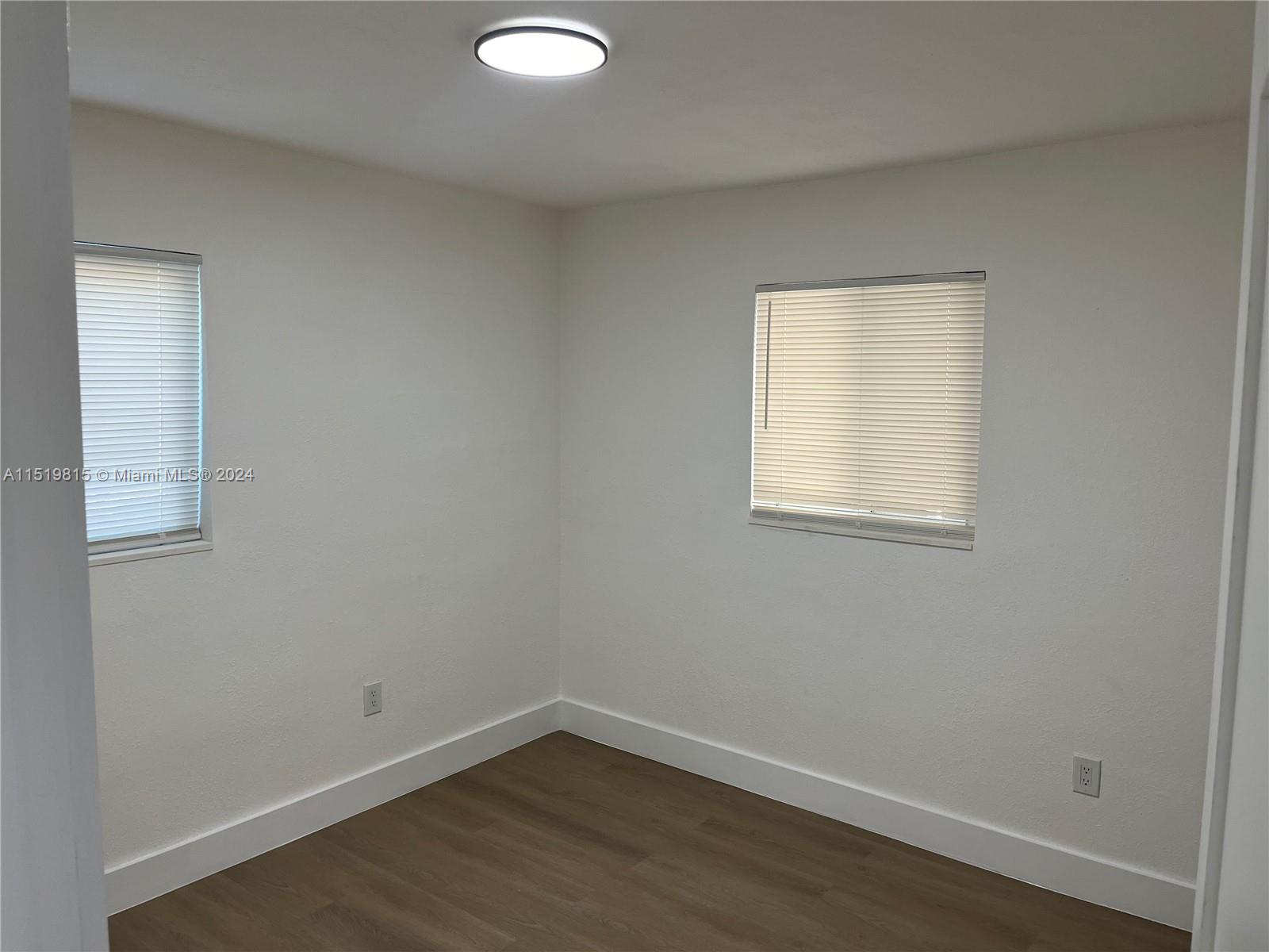 10420 Southwest 42nd Street Miami, FL 33165 - Photo 12 of 17 an empty room with a window