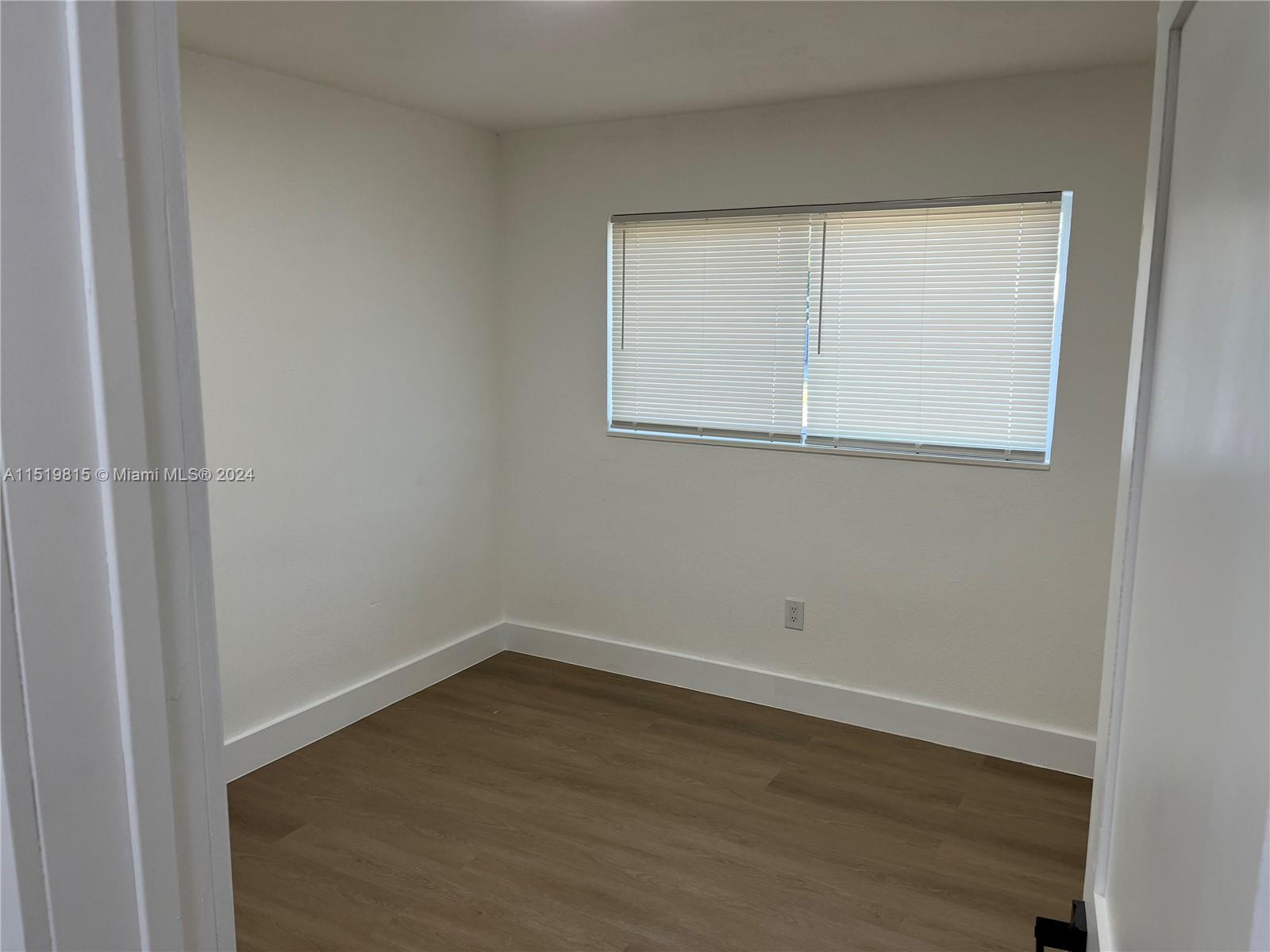 10420 Southwest 42nd Street Miami, FL 33165 - Photo 10 of 17 an empty room with a window