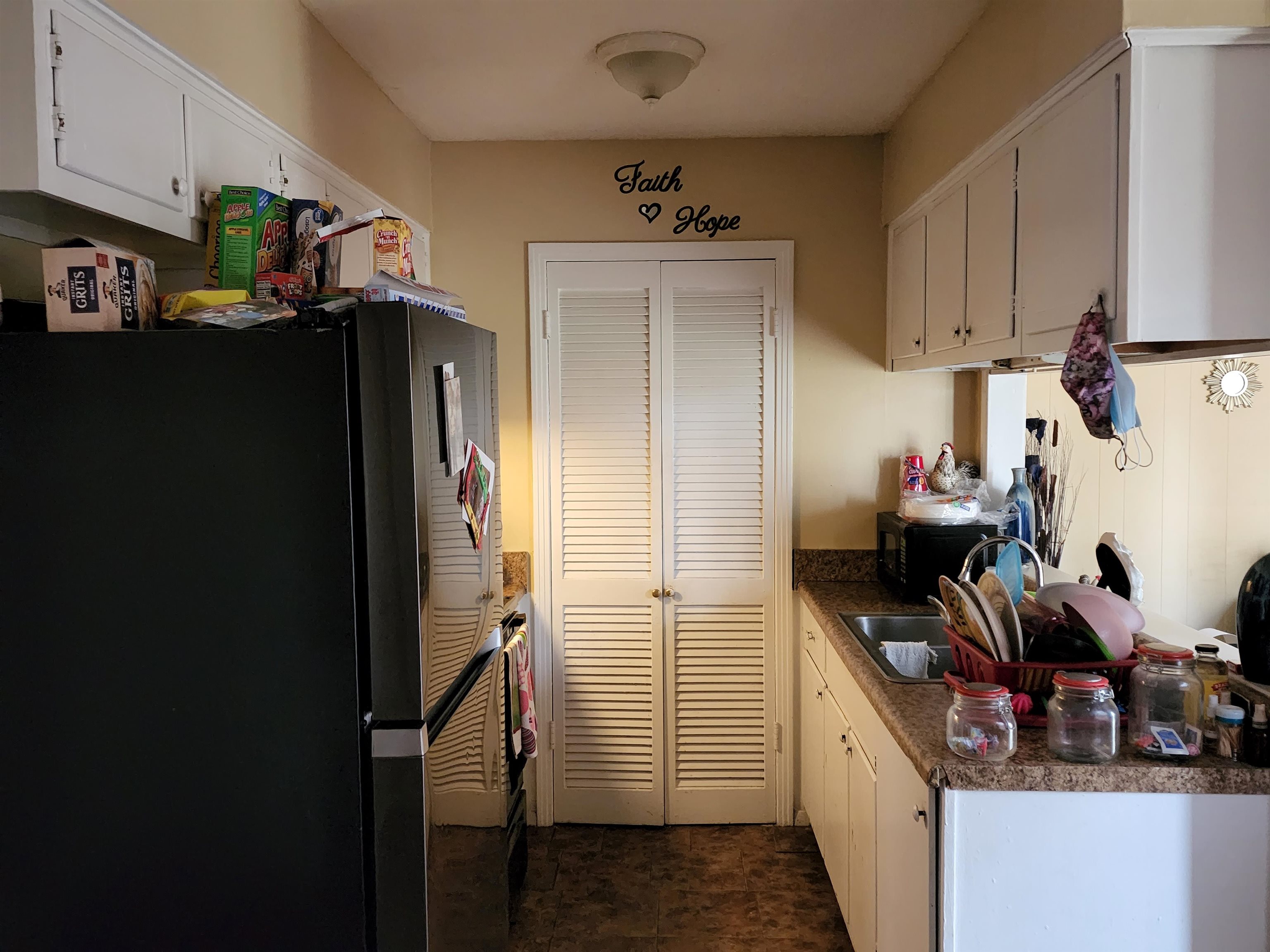 1694 Winfield Road Memphis, TN 38116 - Photo 6 of 19 a kitchen with refrigerator and cabinets