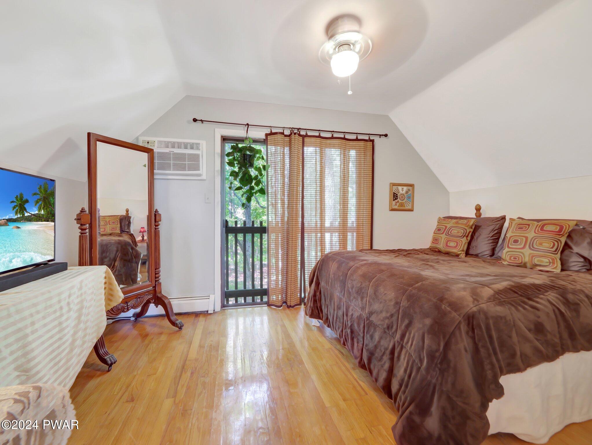 3178 Cherry Ridge Road Bushkill, PA 18324 - Photo 19 of 54 a bed sitting in a spacious bedroom next to a window