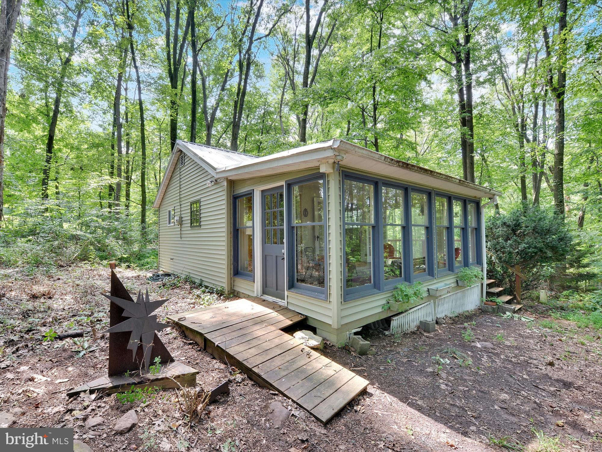 540 Hill Road Denver, PA 17517 - Photo 2 of 25 a view of a house with backyard and garden