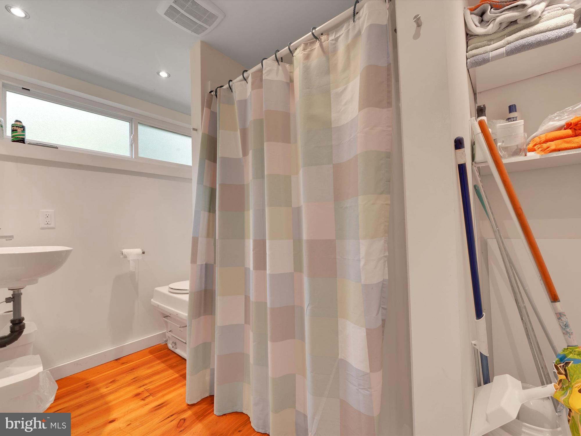540 Hill Road Denver, PA 17517 - Photo 13 of 25 a bathroom with a toilet and a shower curtain