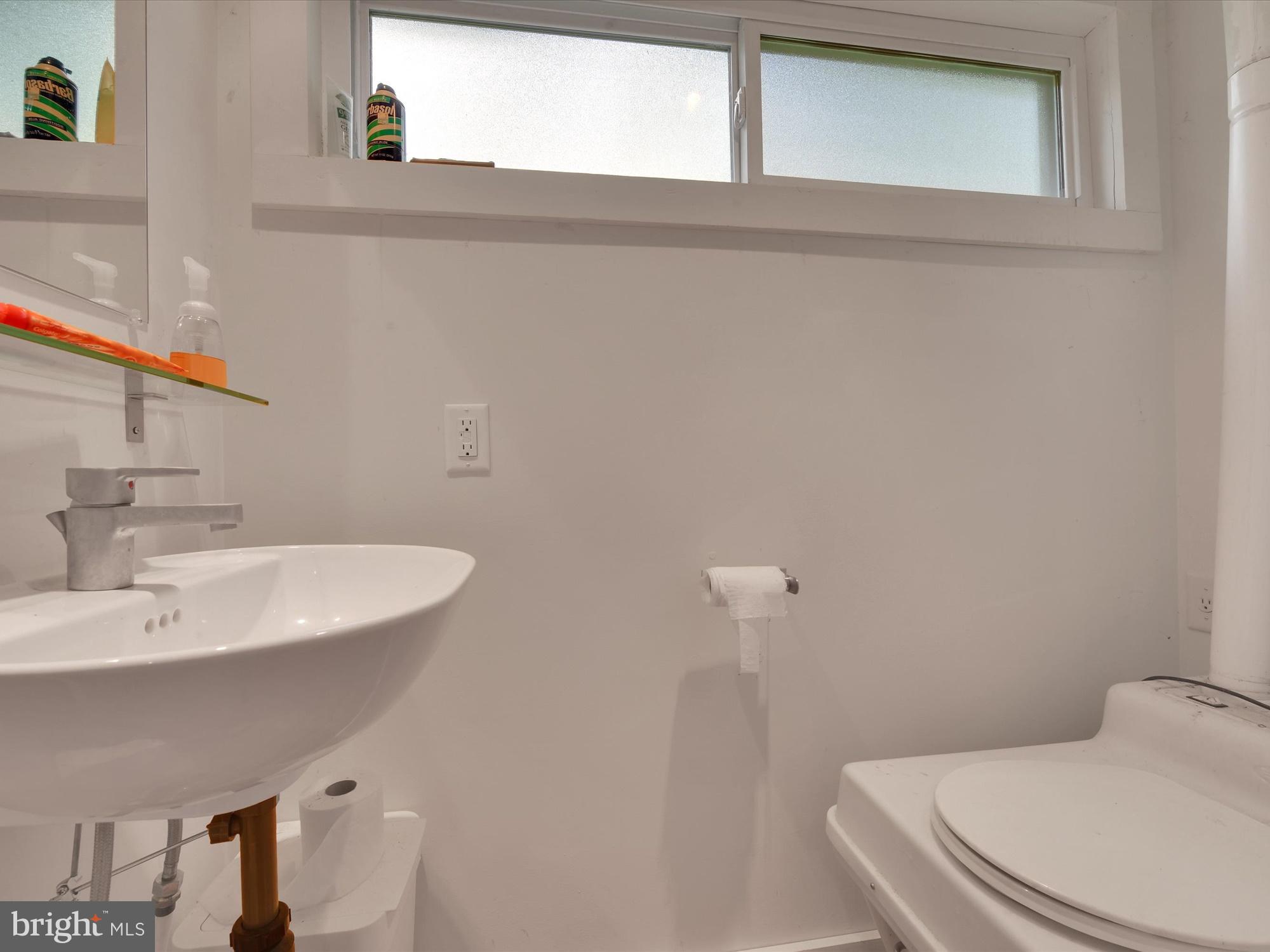 540 Hill Road Denver, PA 17517 - Photo 14 of 25 a bathroom with a sink a toilet and mirror