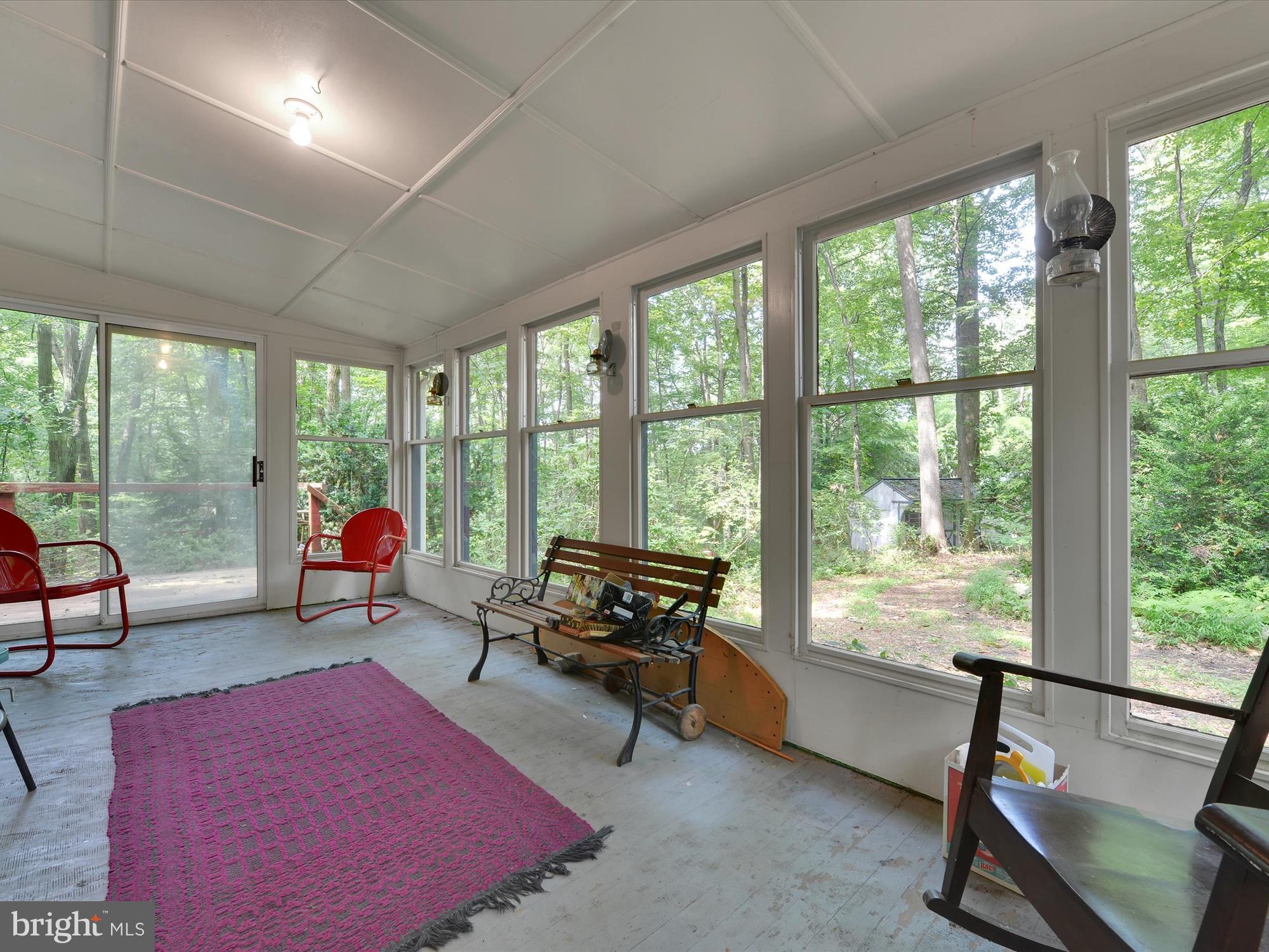 540 Hill Road Denver, PA 17517 - Photo 5 of 25 a living room with furniture and a floor to ceiling window