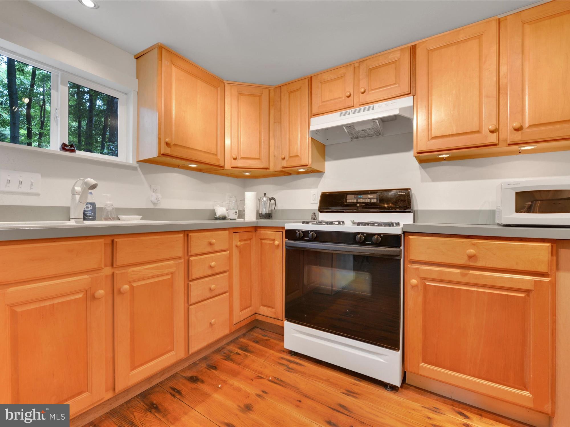 540 Hill Road Denver, PA 17517 - Photo 10 of 25 a kitchen with granite countertop cabinets stainless steel appliances and sink