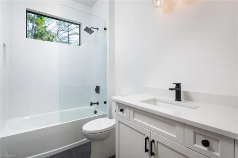 a bathroom with a sink a toilet and a bathtub