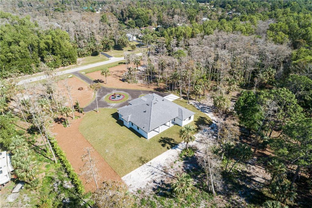 5772 Green Boulevard Naples, FL 34116 - Photo 24 of 24 a view of a yard with a tree