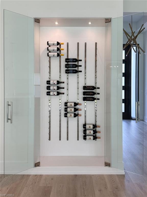 5772 Green Boulevard Naples, FL 34116 - Photo 9 of 24 view of a living room with fireplace