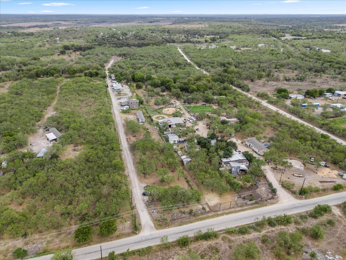 211 Caldwell Road Dale, TX 78616 - Photo 8 of 21 an aerial view of residential houses with outdoor space and trees