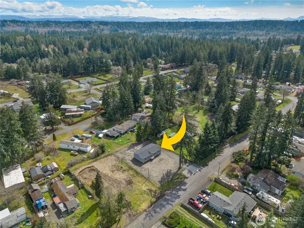 an aerial view of a residential houses with outdoor space