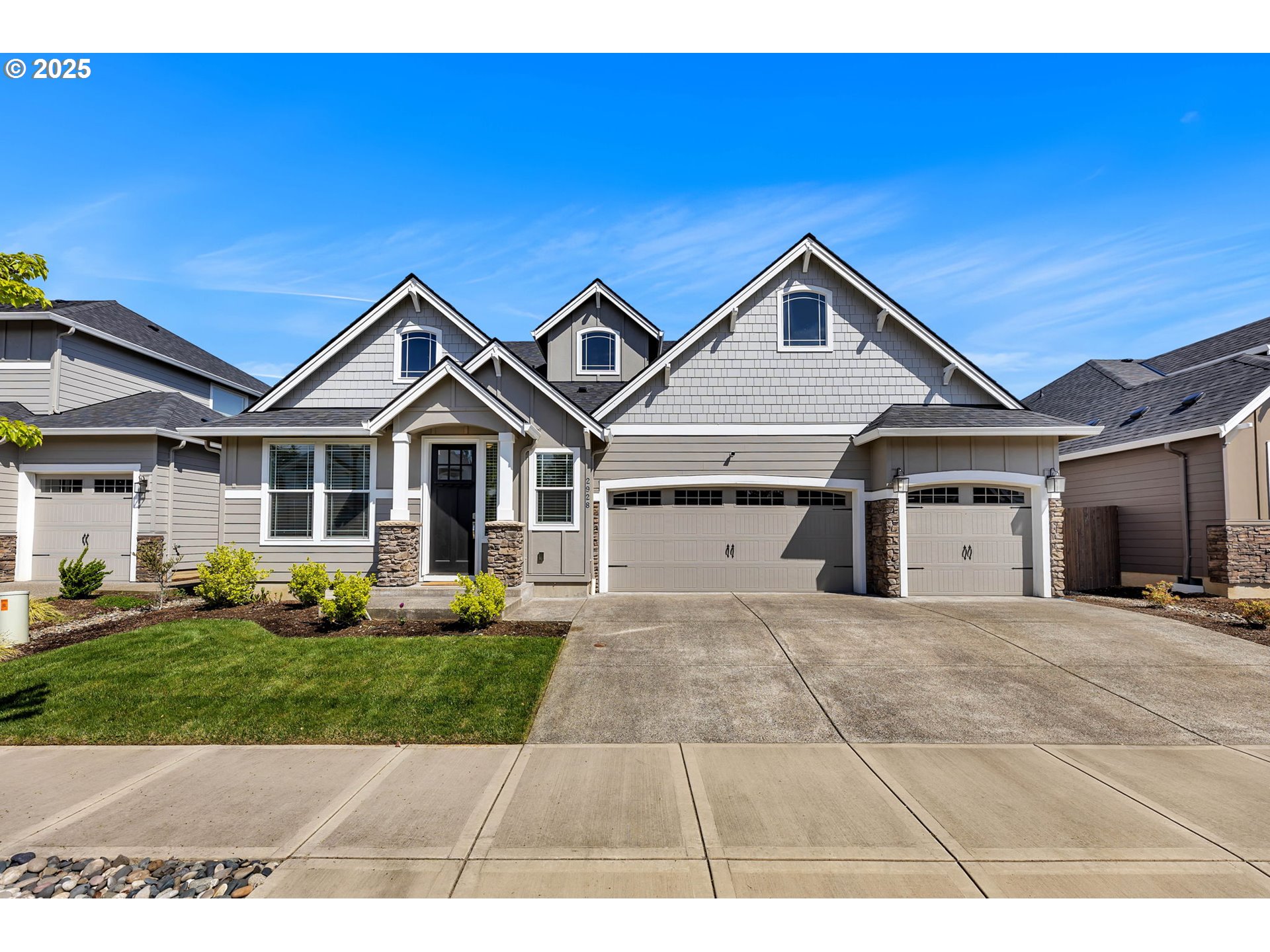 2928 South Harper Valley Way Ridgefield, WA 98642 - Photo 1 of 48 a view of house and yard with large trees