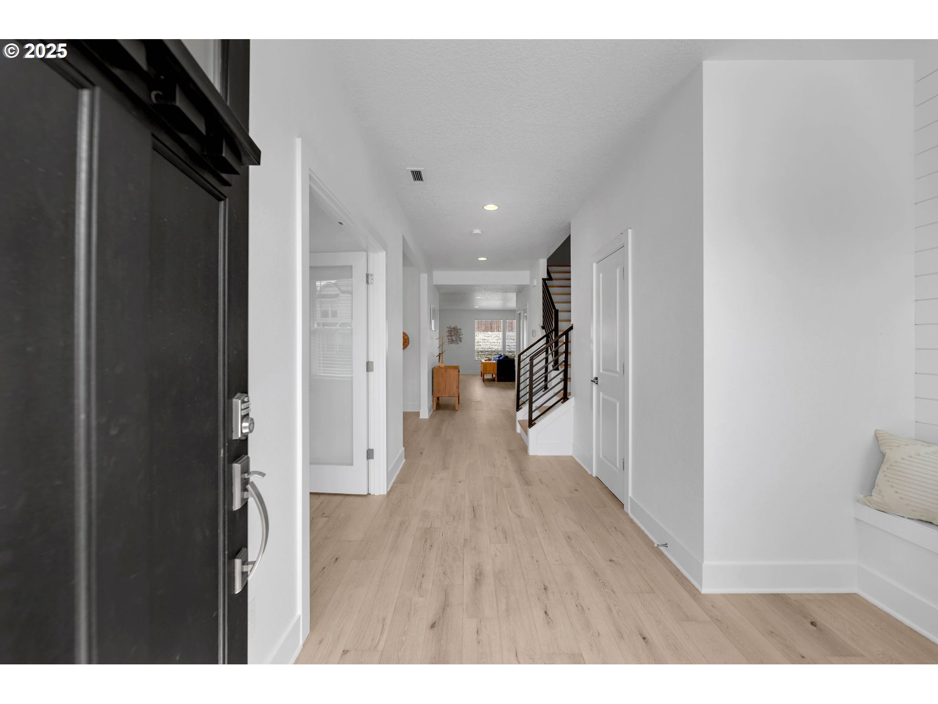 2928 South Harper Valley Way Ridgefield, WA 98642 - Photo 3 of 48 a view of a hallway with wooden floor