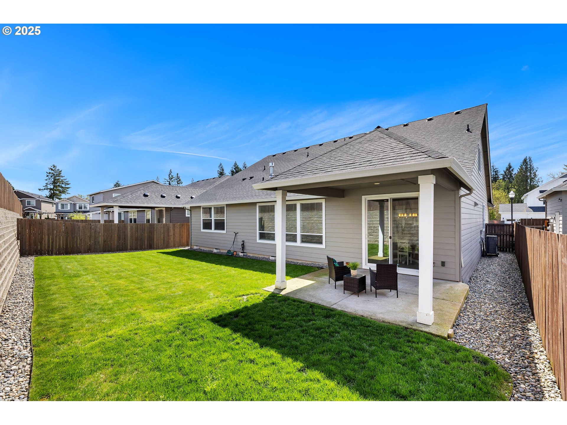 2928 South Harper Valley Way Ridgefield, WA 98642 - Photo 46 of 48 a view of a house with backyard porch and sitting area