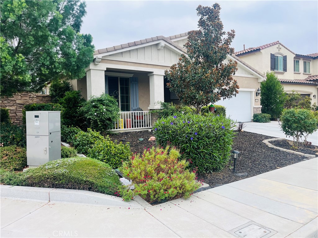 29653 Rigging Way Menifee, CA 92584 - Photo 2 of 11 a front view of a house with garden