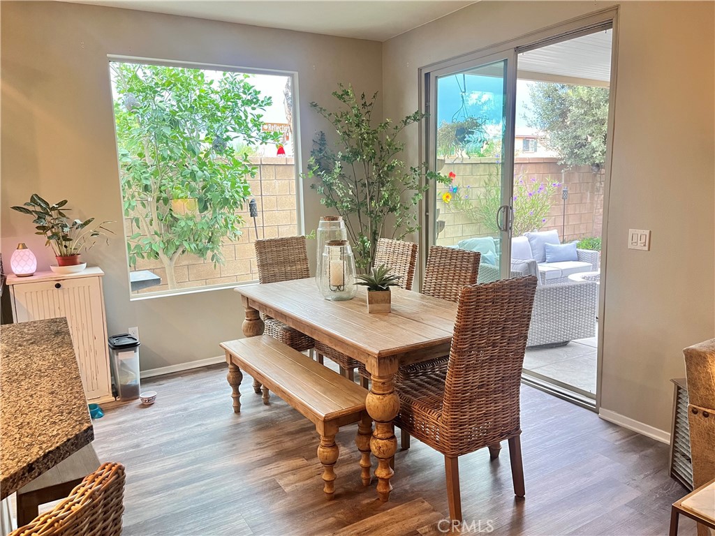 29653 Rigging Way Menifee, CA 92584 - Photo 7 of 11 a view of a dining room with furniture window and wooden floor