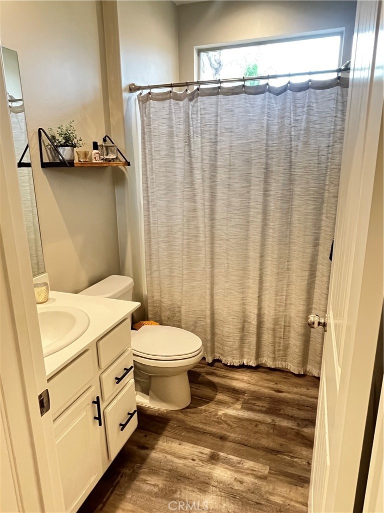 29653 Rigging Way Menifee, CA 92584 - Photo 10 of 11 a bathroom with a sink a toilet and shower