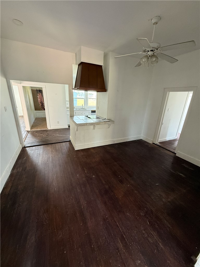 507 Logan Street Calvert, TX 77837 - Photo 4 of 19 wooden floor in an empty room with a window