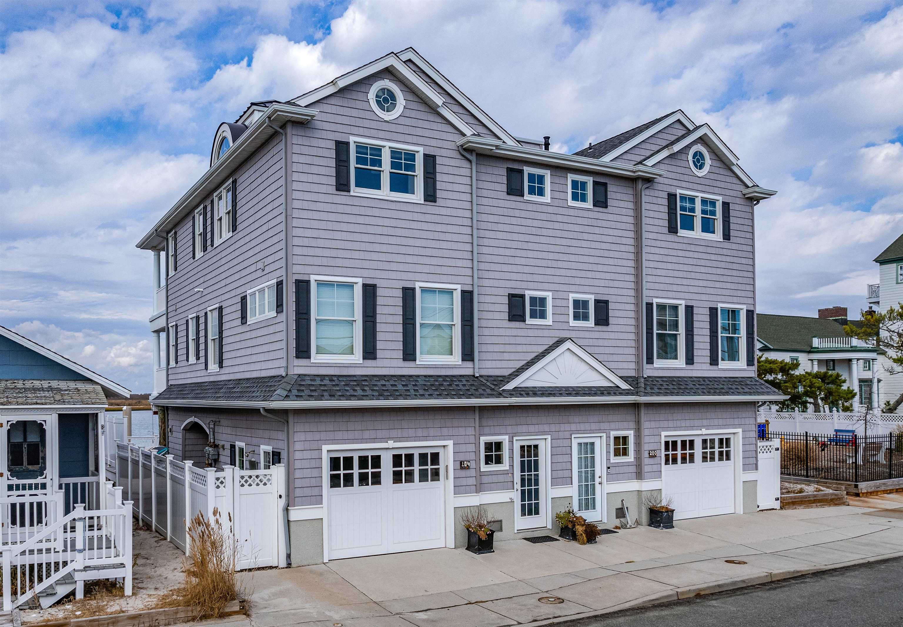 204 South Bayview, Unit SOUTH Strathmere, NJ 08248 - Photo 1 of 21 a front view of a house with parking