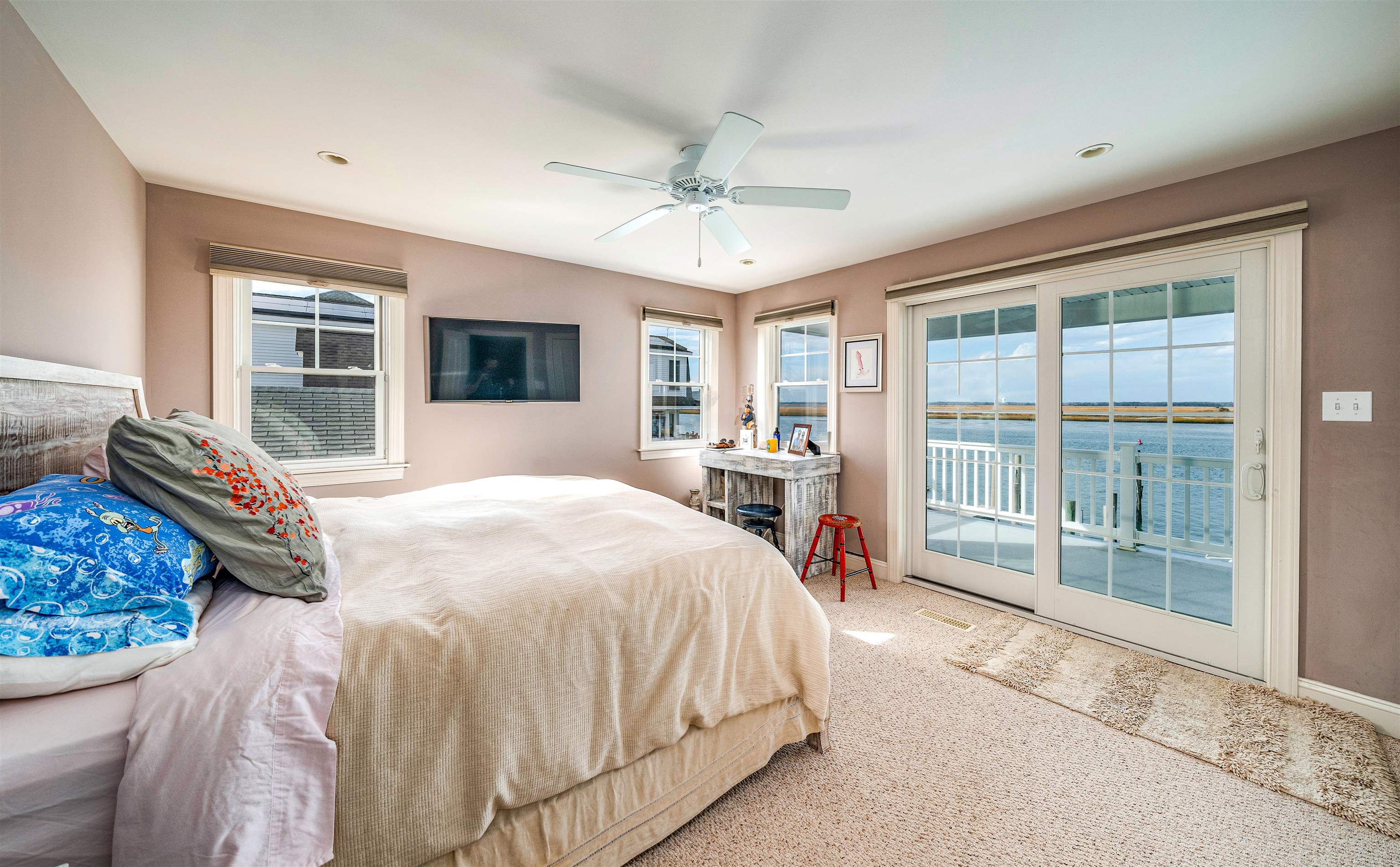 204 South Bayview, Unit SOUTH Strathmere, NJ 08248 - Photo 9 of 21 a spacious bedroom with a large bed and a large window