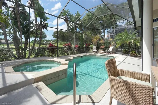 a view of a swimming pool with a garden and plants