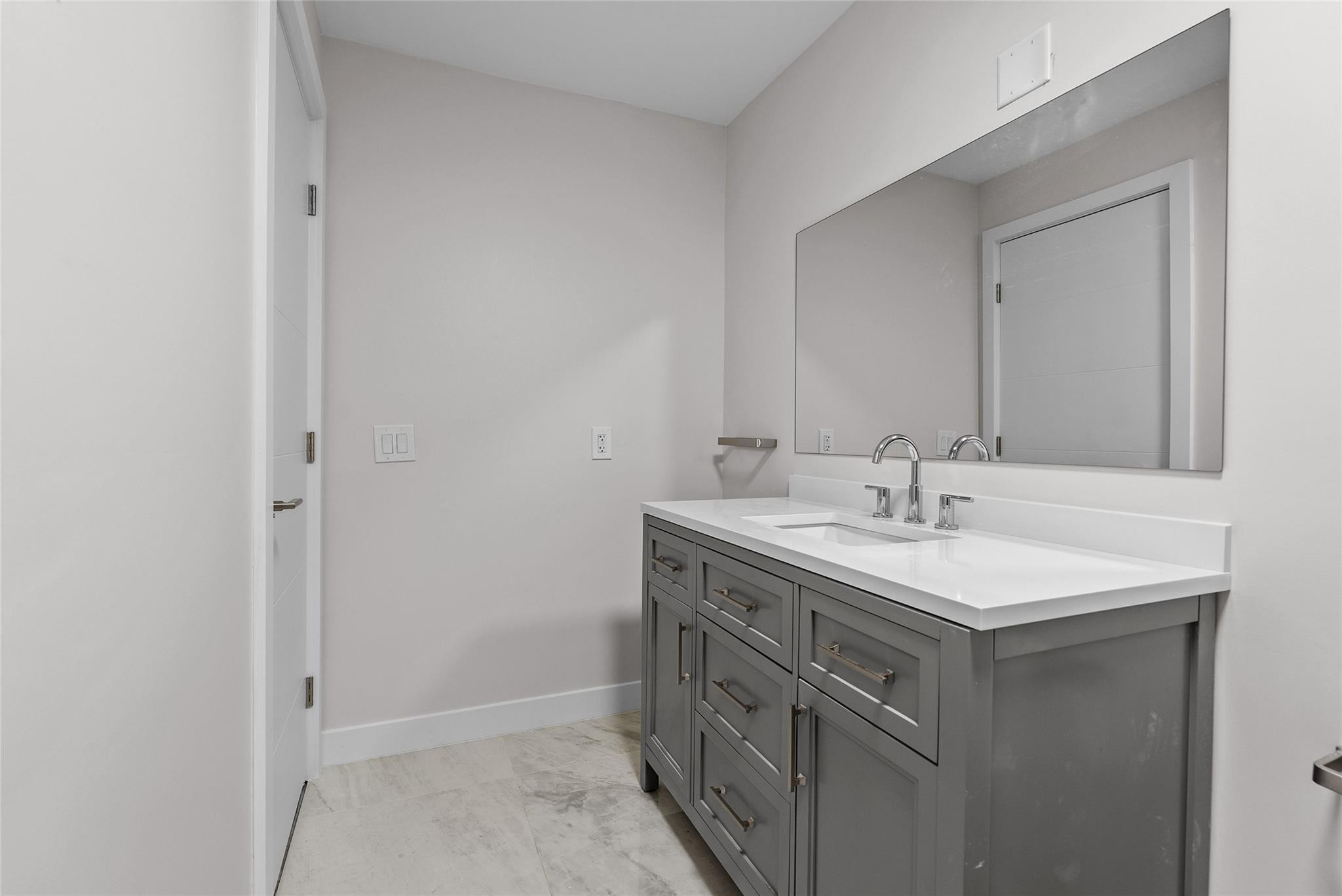 1150 East Sample Road, Unit 202 Pompano Beach, FL 33064 - Photo 16 of 20 a bathroom with a sink and a mirror