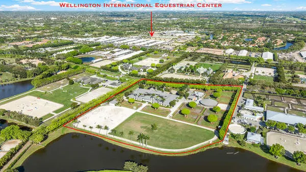 an aerial view of a pool yard and lake view