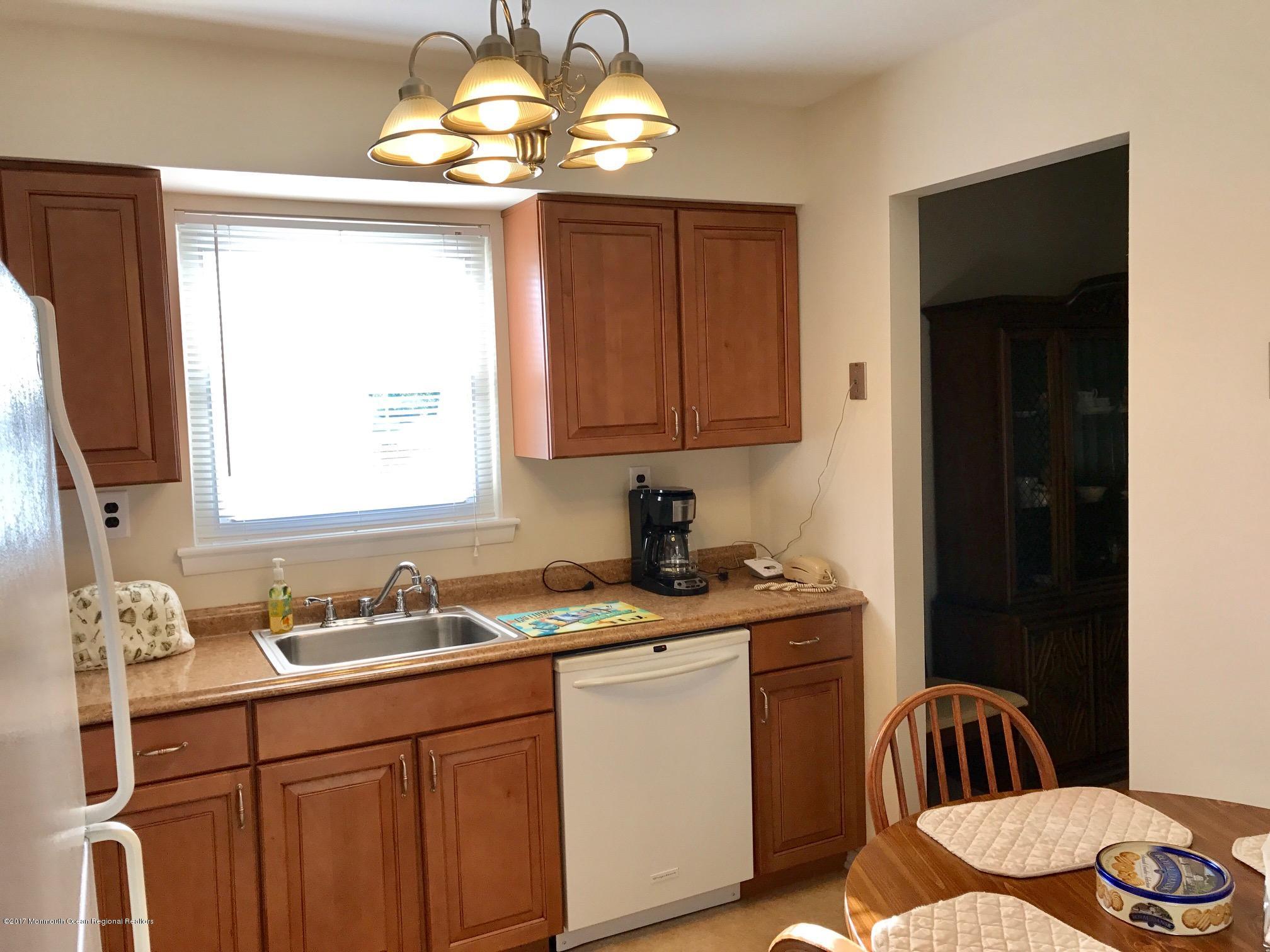12 Dryden Road Brick, NJ 08724 - Photo 4 of 22 a kitchen with a sink cabinets and window