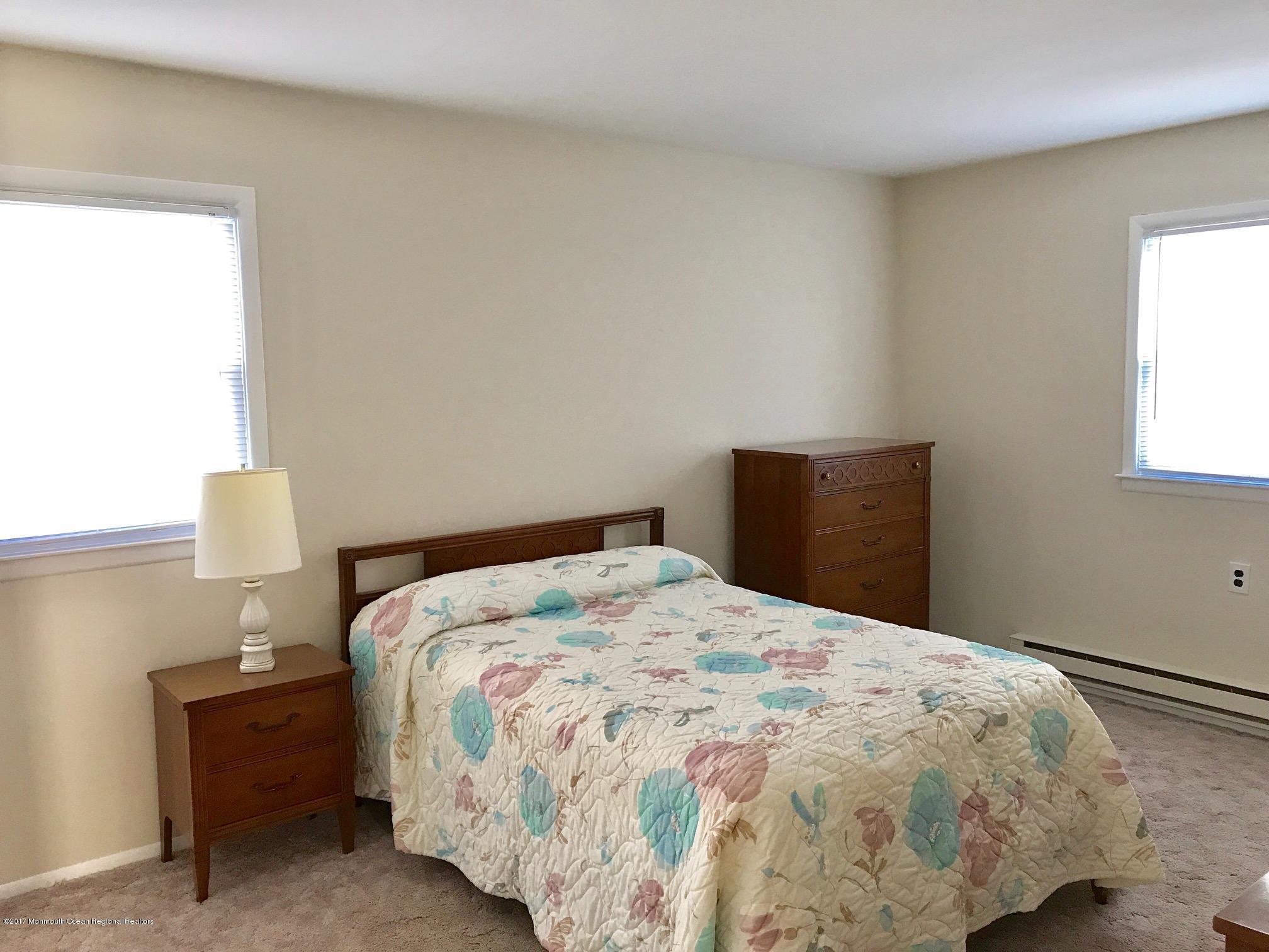 12 Dryden Road Brick, NJ 08724 - Photo 8 of 22 a bedroom with a bed and a window