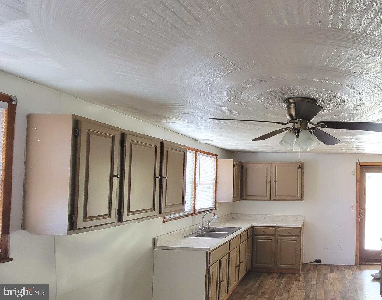 12809 Walsh Road Mount Savage, MD 21545 - Photo 21 of 30 a kitchen with a refrigerator stove and cabinets