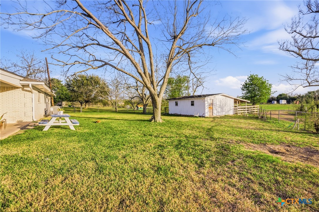 911 West Constitution Street Victoria, TX 77901 - Photo 35 of 42 a house view with swimming pool