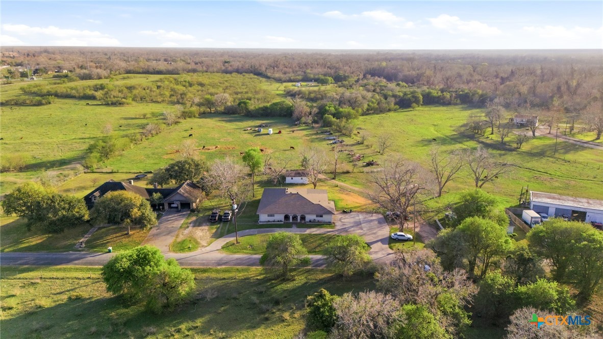 911 West Constitution Street Victoria, TX 77901 - Photo 42 of 42 an aerial view of residential houses with outdoor space