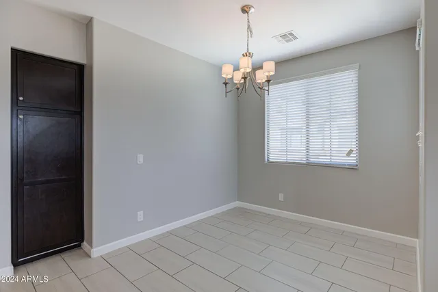 a view of kitchen with stainless steel appliances granite countertop a stove top oven a sink dishwasher and a refrigerator