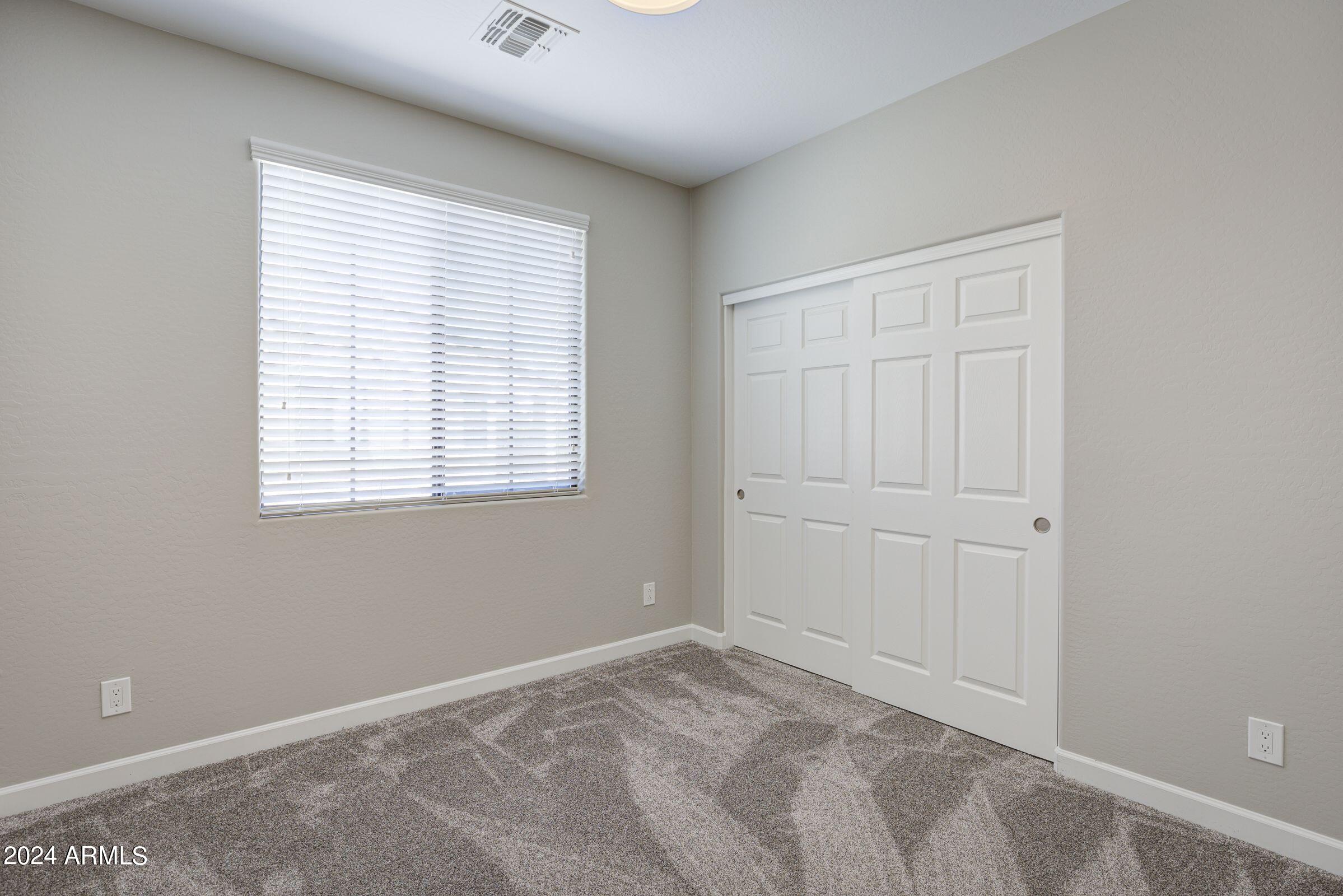 4777 South Fulton Ranch Boulevard, Unit 2066 Chandler, AZ 85248 - Photo 20 of 46 an empty room with windows