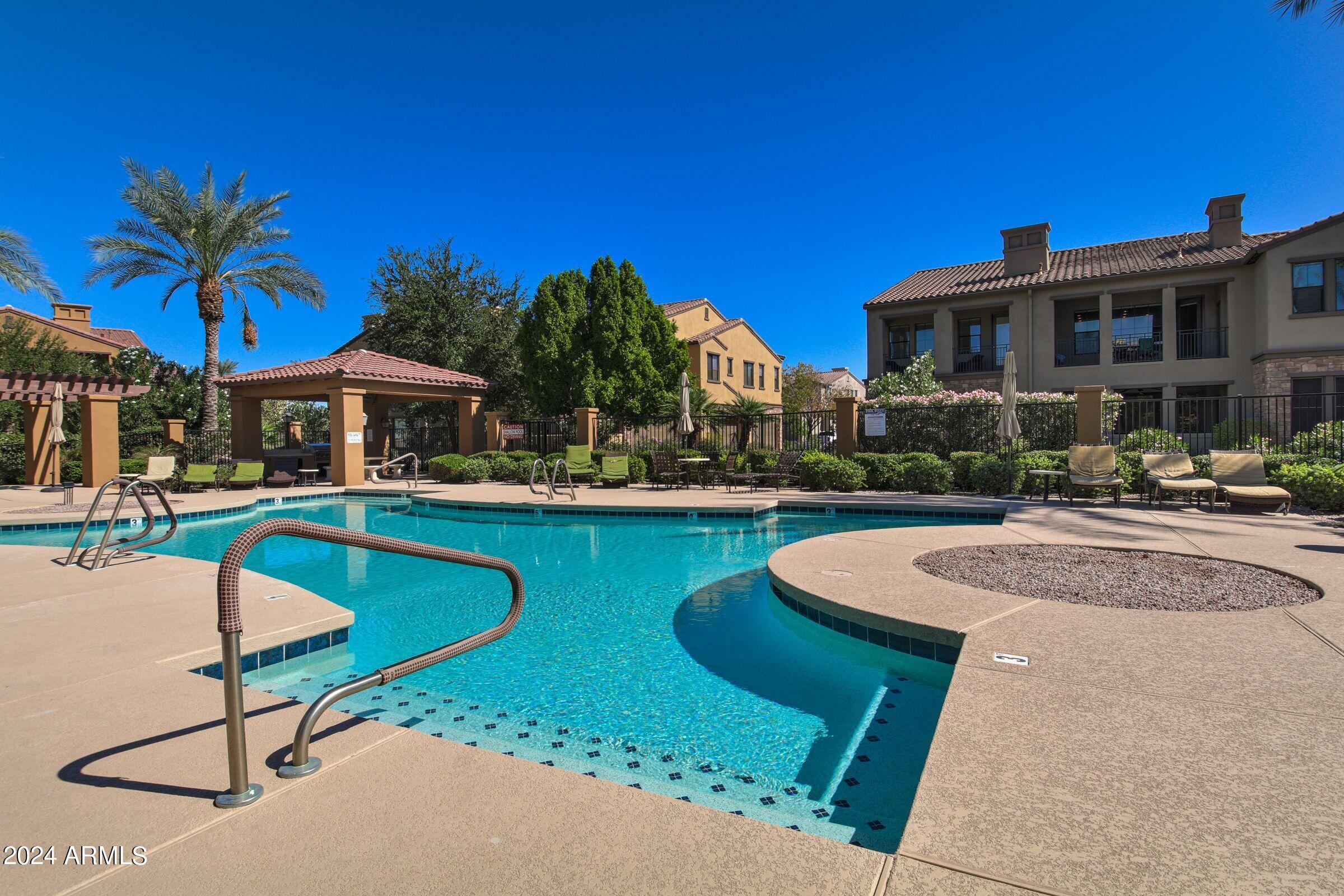 4777 South Fulton Ranch Boulevard, Unit 2066 Chandler, AZ 85248 - Photo 35 of 46 a front view of house with yard and outdoor seating
